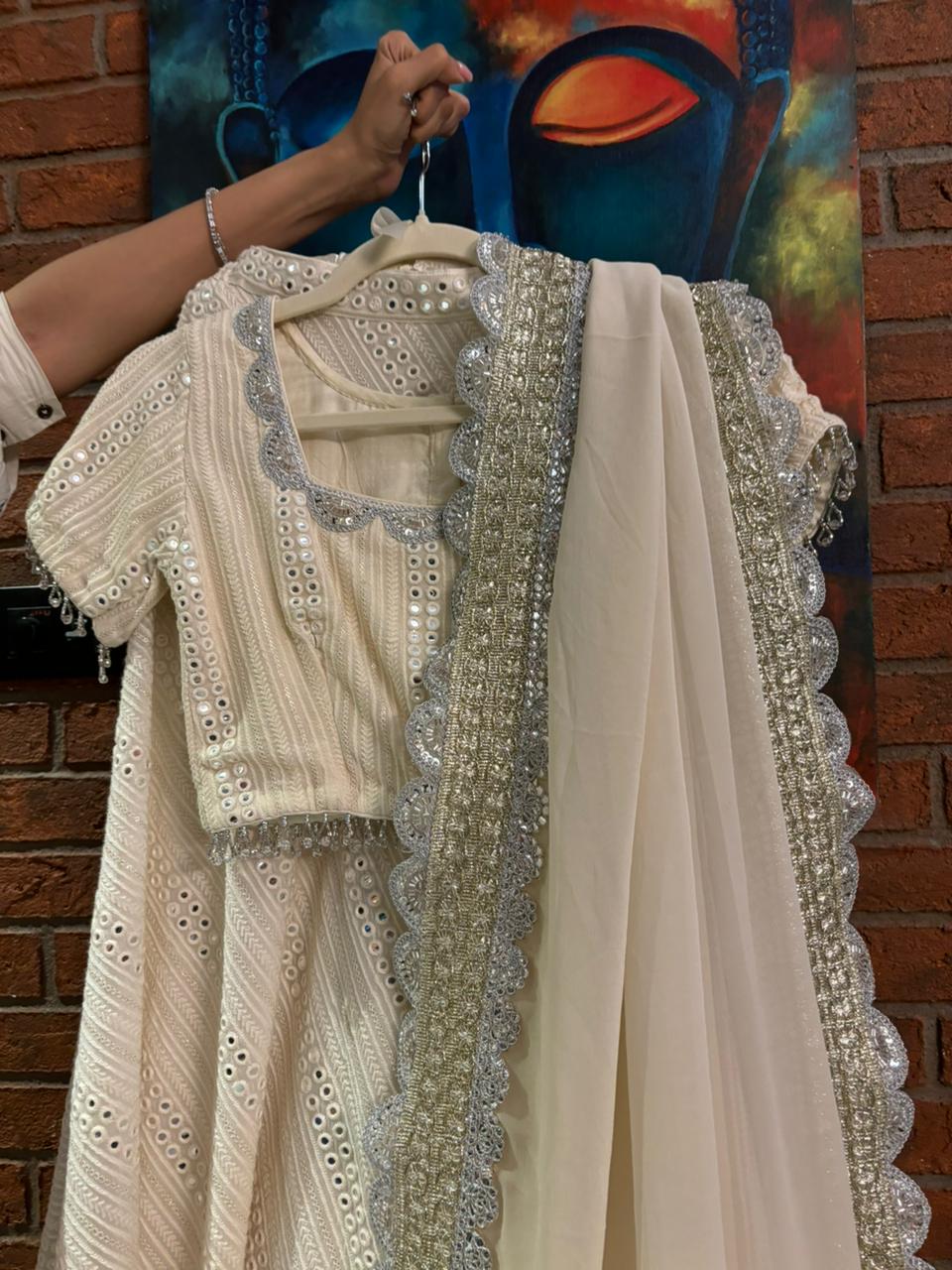 Fabulous off white mirror work lehenga set