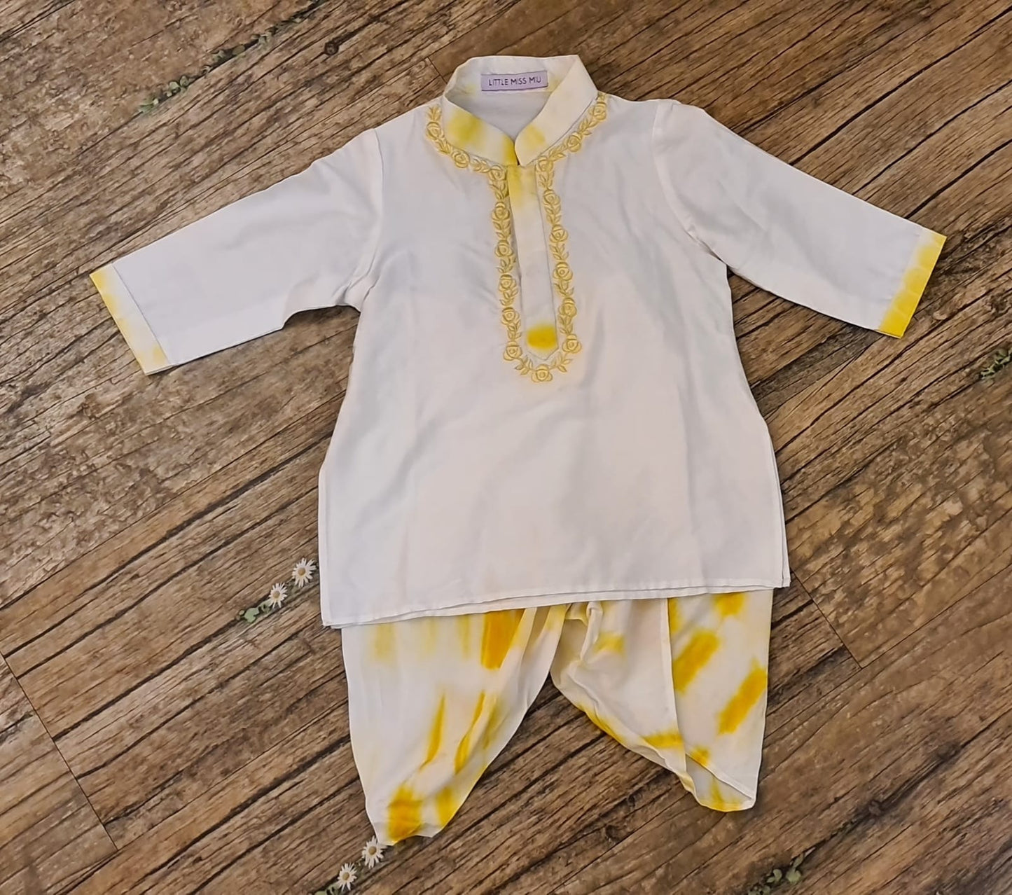 White kurta and yellow batik dhoti set