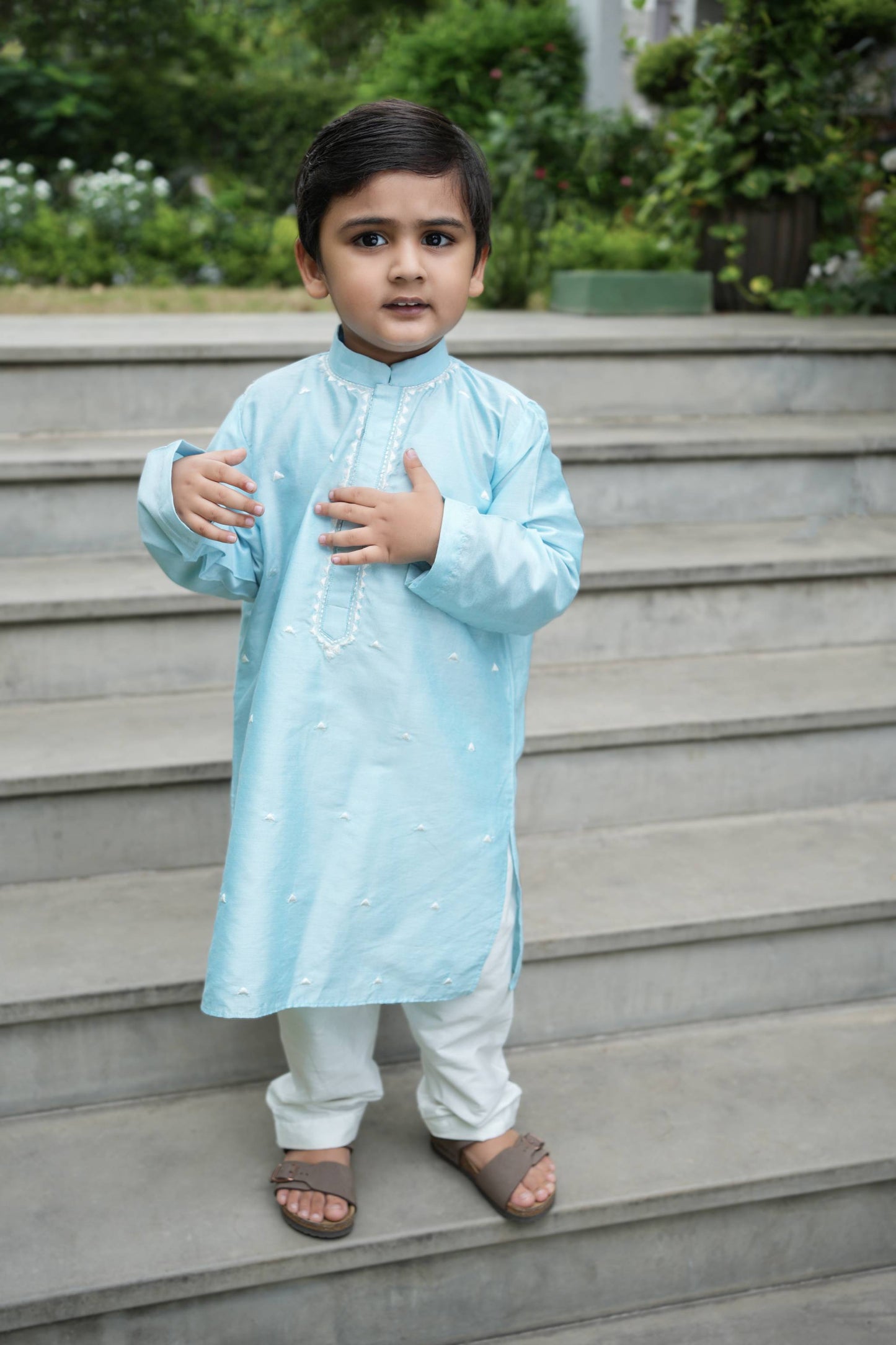 Charming skyblue kurta with zig-zag thread work embroidery & dainty thread work booties spread all over with white pants set
