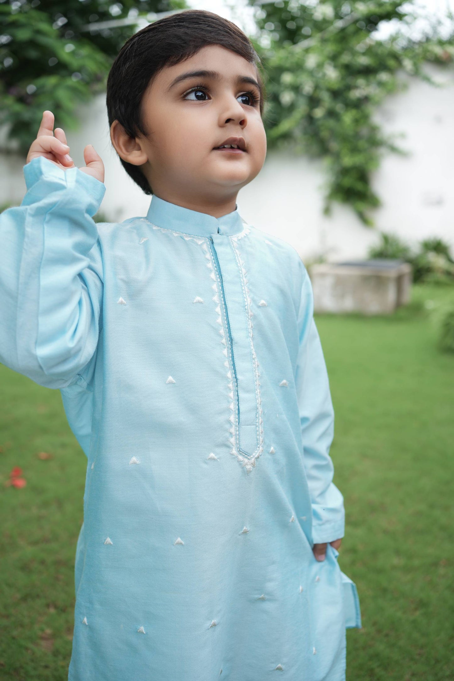 Charming skyblue kurta with zig-zag thread work embroidery & dainty thread work booties spread all over with white pants set