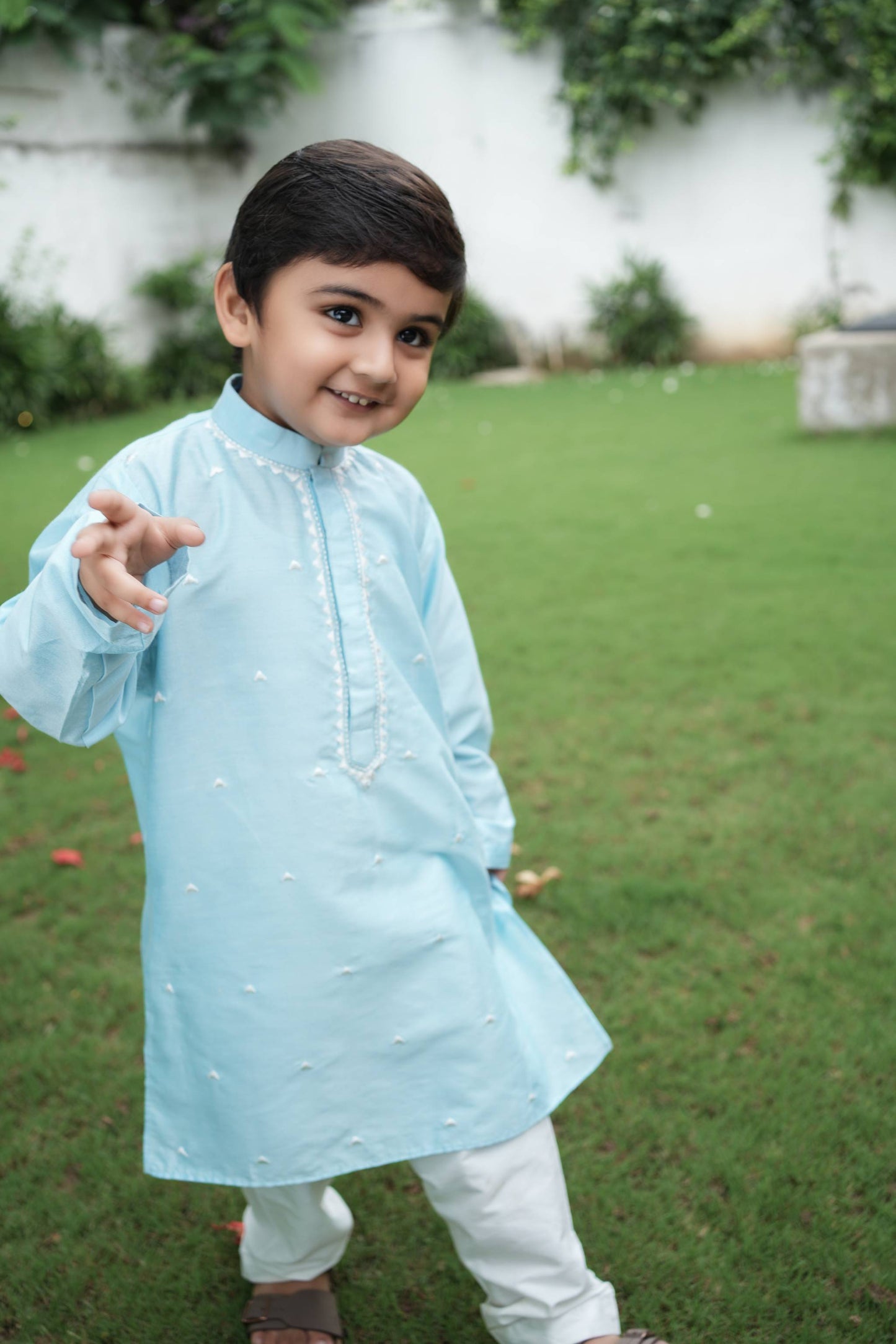 Charming skyblue kurta with zig-zag thread work embroidery & dainty thread work booties spread all over with white pants set