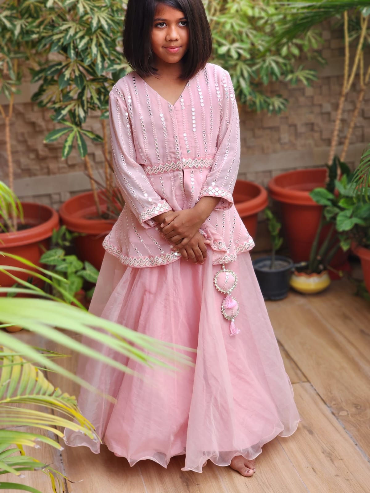 Pretty Baby pink mirror work peplam top with a beautiful organza skirt