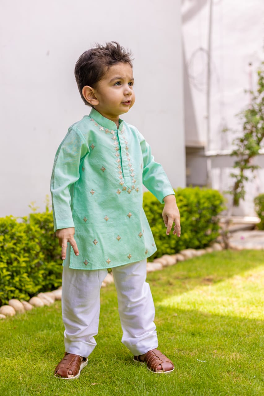 Gorgeous green pitten work kurta set