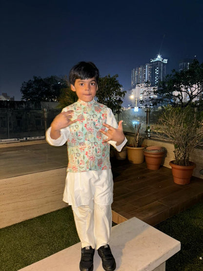 Royal white kurta with dori work and a gorgeous aqua floral jacket alongwith pants set